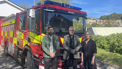 Jack Brian Katie standing in front of a fire truck