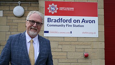 Brian smiling outside the BoA fire station