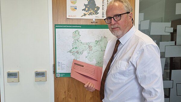 Brian holding a folder