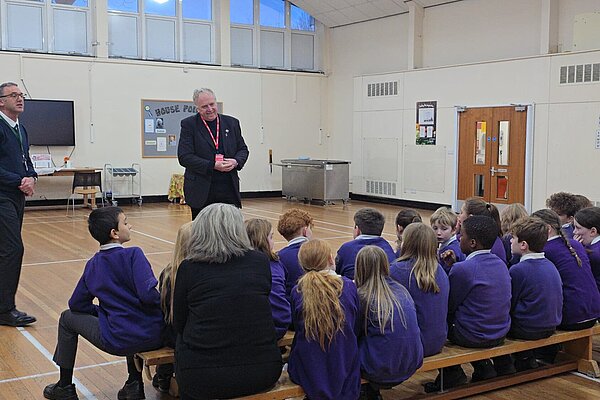 Brian listening to pupils
