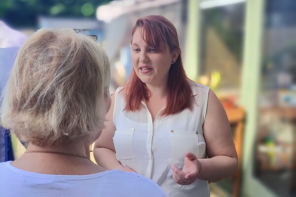 Charlie talking to a resident